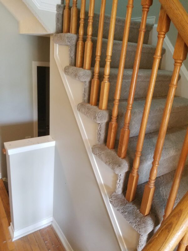 A staircase with carpet installed on it