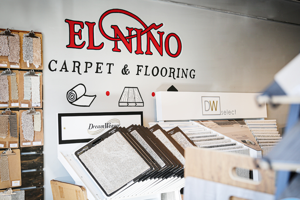 El Nino Carpet and Flooring Burlington location branding on the inside of the store