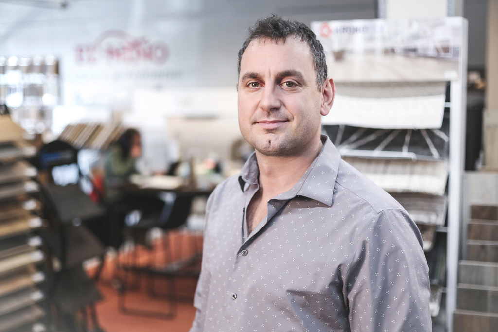 Christian Baudino standing inside of one of El Nino Carpet and Flooring's locations