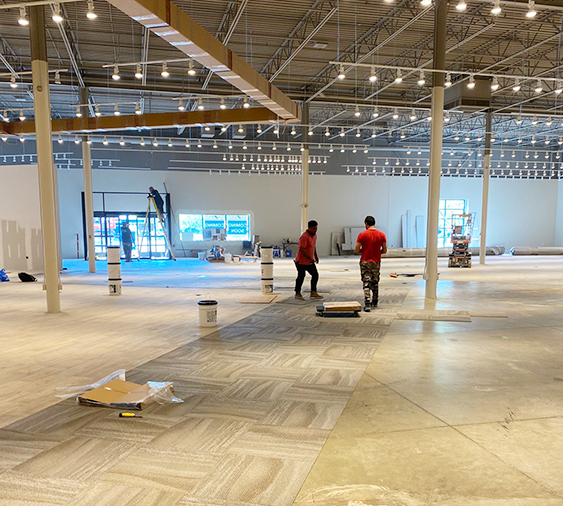 El Nino Carpet and Flooring highly trained professionals completing an installation at a commercial building in Ontario