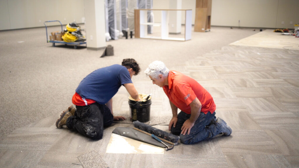 Carpet installation being completed by El Nino Carpet and Flooring professionals at a La-Z-Boy Home Furnishings store in Etobicoke, Ontario
