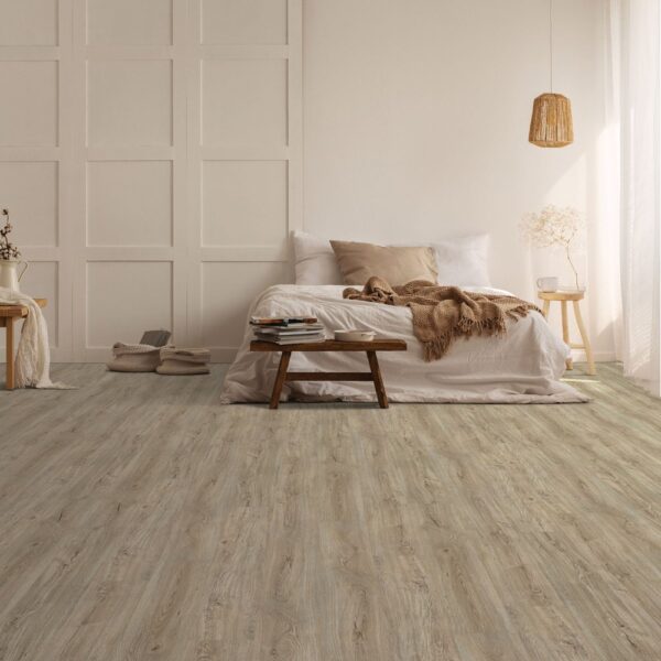 Next Floor Medalist collection 453-430 Linen Oak vinyl flooring installed in a bedroom
