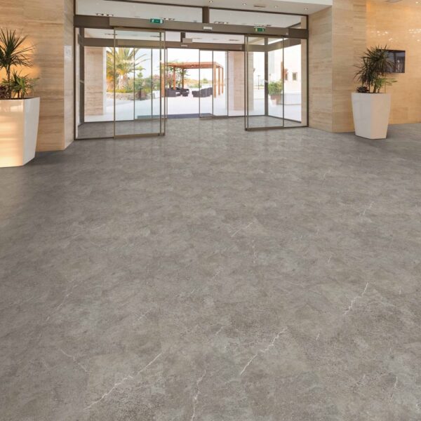 Next Floor Tuscan Sandstone collection Fossil 446-101 vinyl flooring installed in a lobby