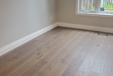 Canadian Standard in colour Webster hardwood installed in a home's living room by El Nino Carpet and Flooring